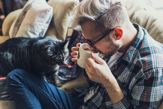 Guy with cat and coffee